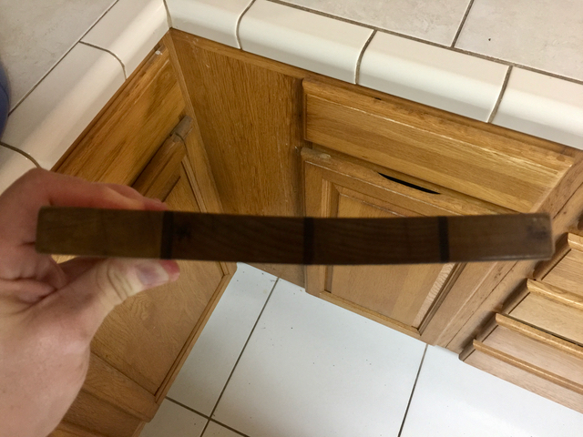 Warped wooden cutting board.